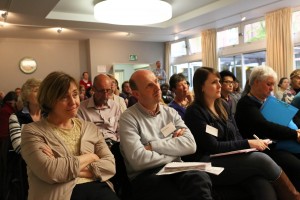 The crowd at the conference listen intently
