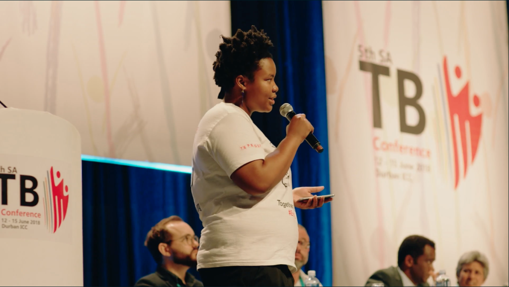Zolelwa speaking at 5th annual TB conference in Durban, 2018. Image: Still from UnMasked.