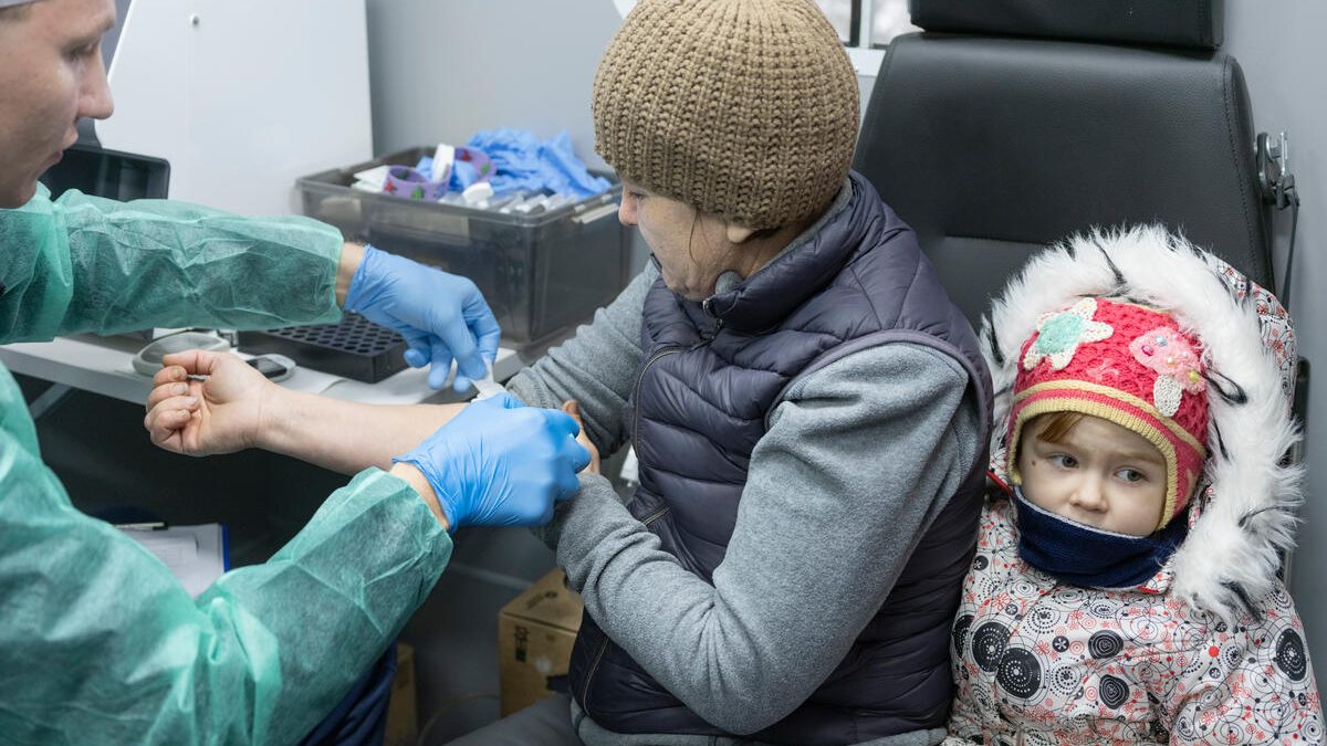 The healthcare worker provides medical assistance to the patient who showed up at the mobile clinic
in Svyatohirsk, the war-hit town in Donetsk region, Ukraine, on Dec. 13, 2024.