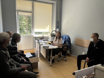 Olya in her workspace, supporting the TB community